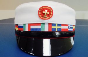 The cap with the flag band is used by the international schools.